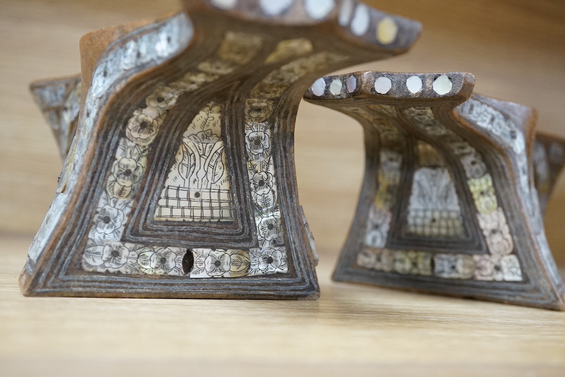 A pair of Islamic wood and engraved mother-of-pearl qabqab (shoes), 25cm wide. Condition - some losses
